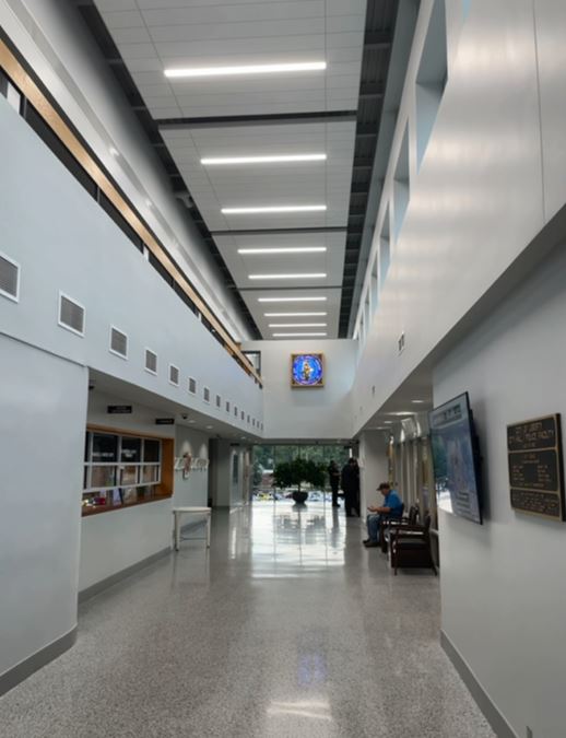 Photo of new ceiling in Liberty City Hall with stained glass piece on wall below Photo of new ceiling in Liberty City Hall with stained glass piece on wall below