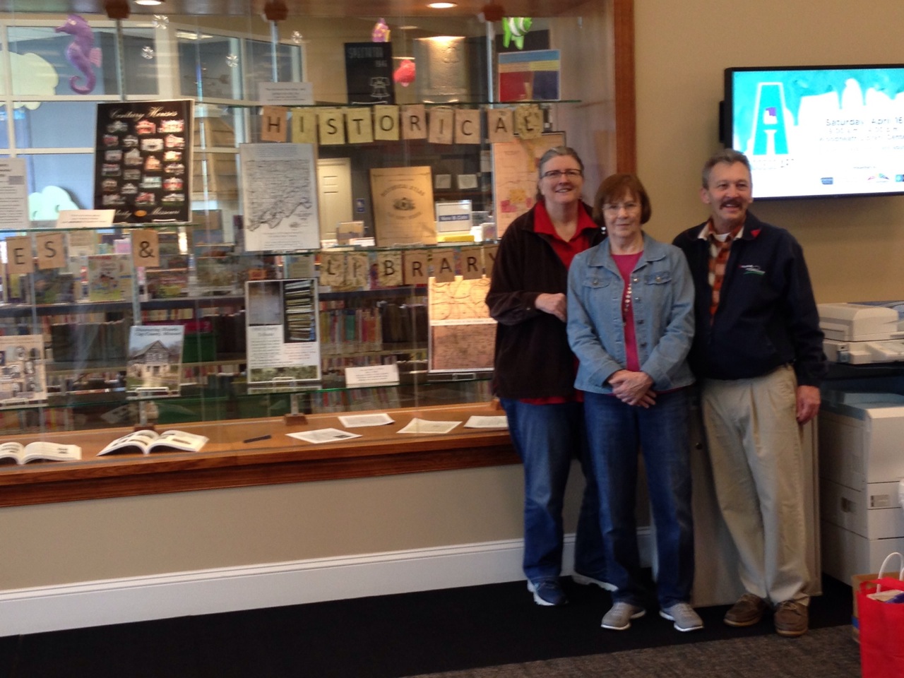 Photograph of Archives volunteers at display in Smithville Library